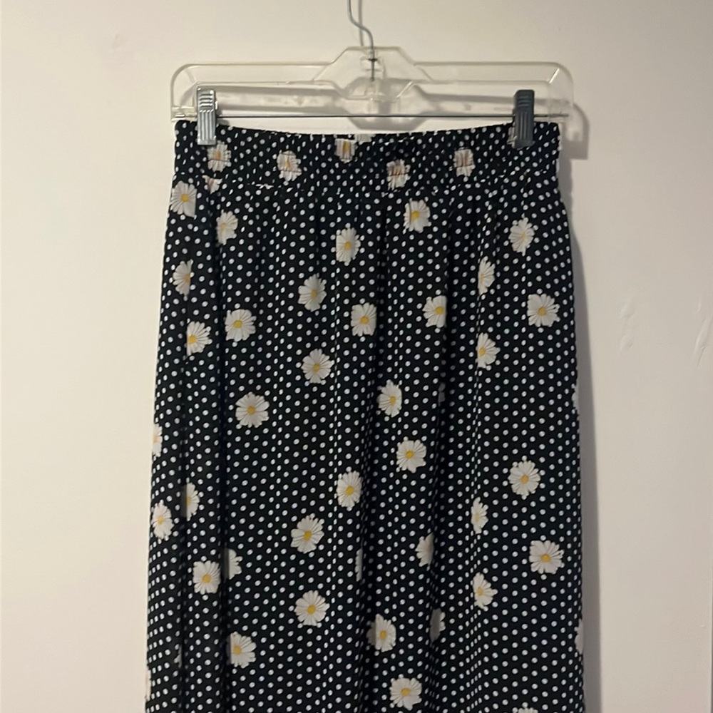 Long black and white polka dot skirt with flower print purchased from Roolee